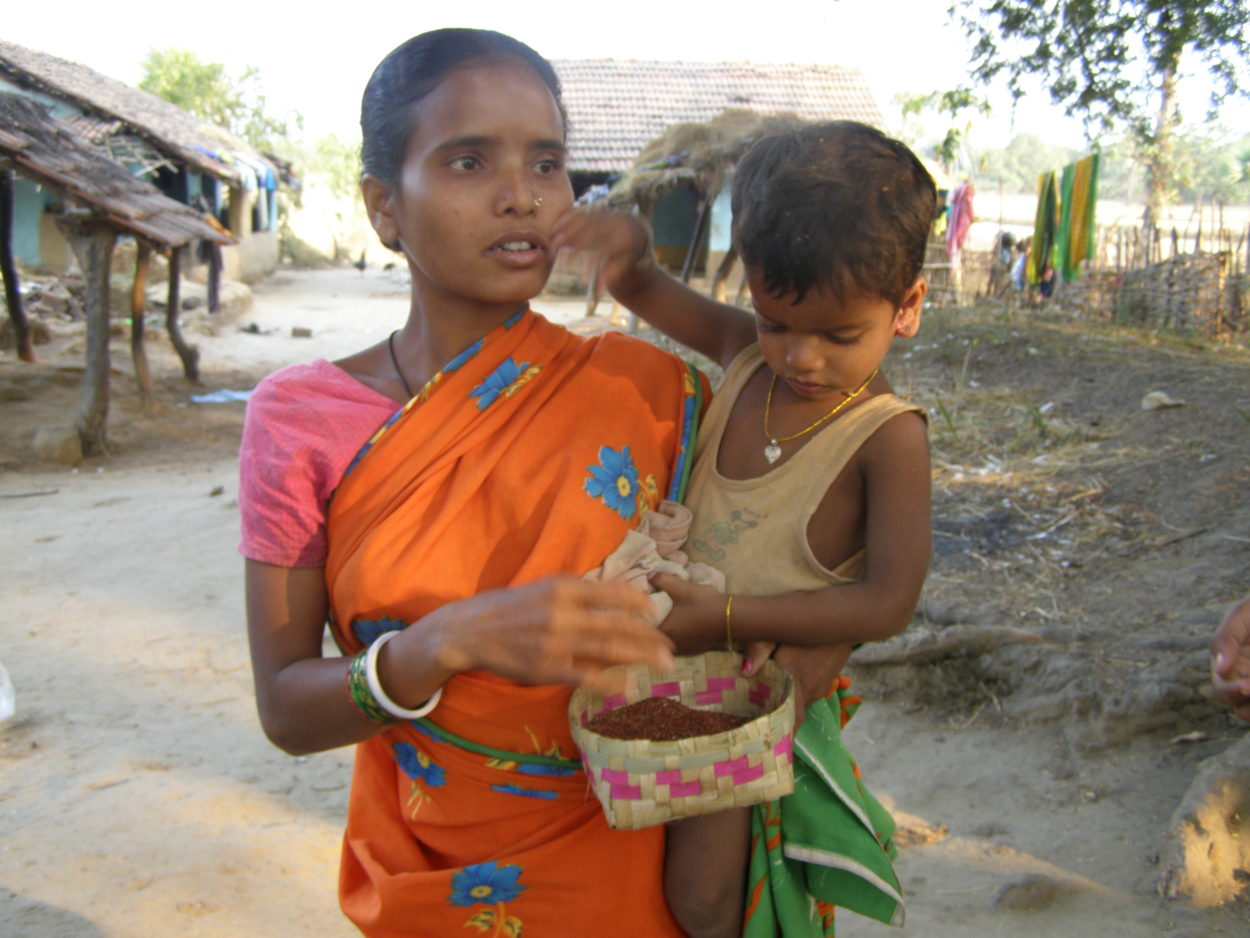 Asha, with child and ragi, a local millet