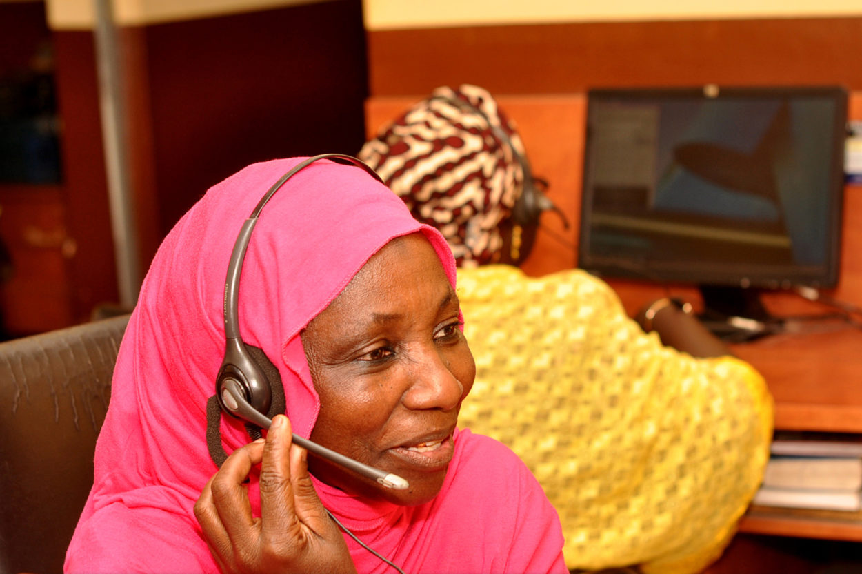 Maryam Kole replies to a call in the call center for the emergency transport scheme